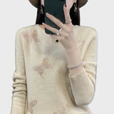 Damski pleciony sweter z wzorem motyla
