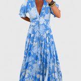 Minelda | Elegancka sukienka w kwiatowy wzór z dekoltem w kształcie litery V