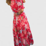 Minelda | Elegancka sukienka w kwiatowy wzór z dekoltem w kształcie litery V